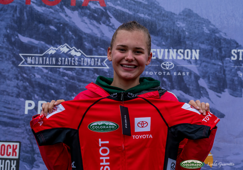 Race# YAMPA PODIUMS Rider Holds Up Red Jersey On The Podium () Race# YAMPA PODIUMS Rider Holds Up Red Jersey On The Podium ()