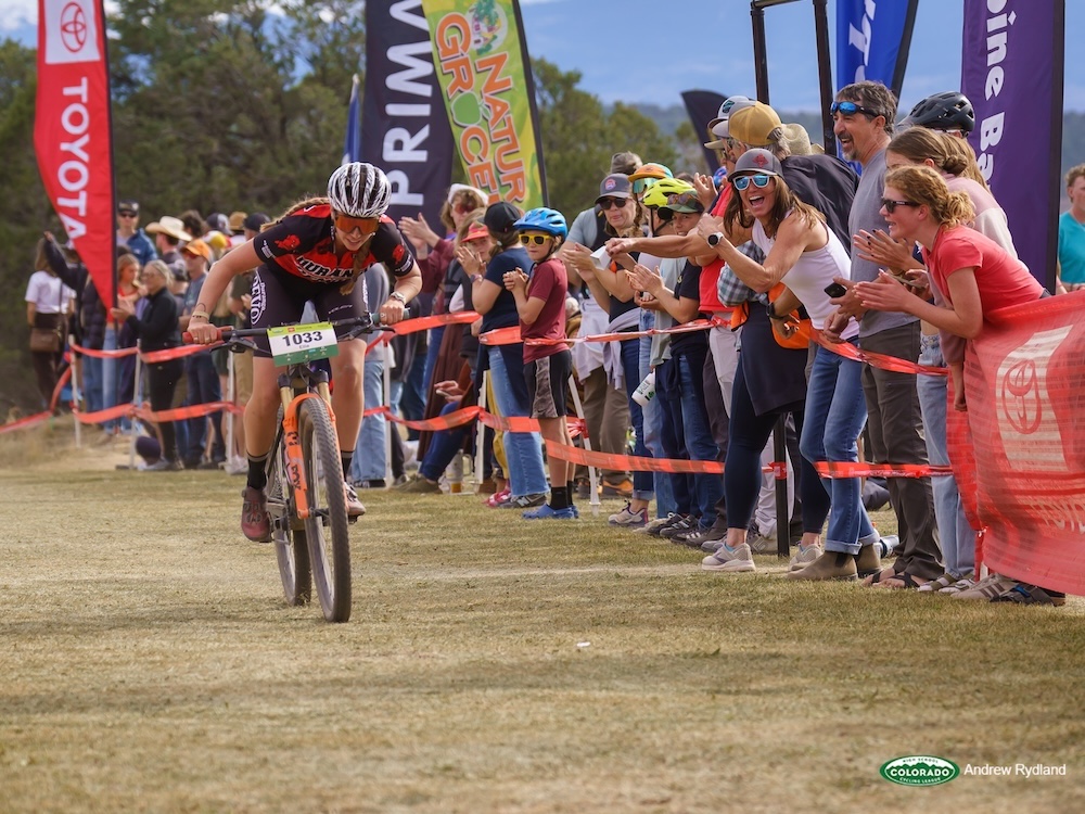 States Similing Rider Heads For The Finish With Crowd Cheering
